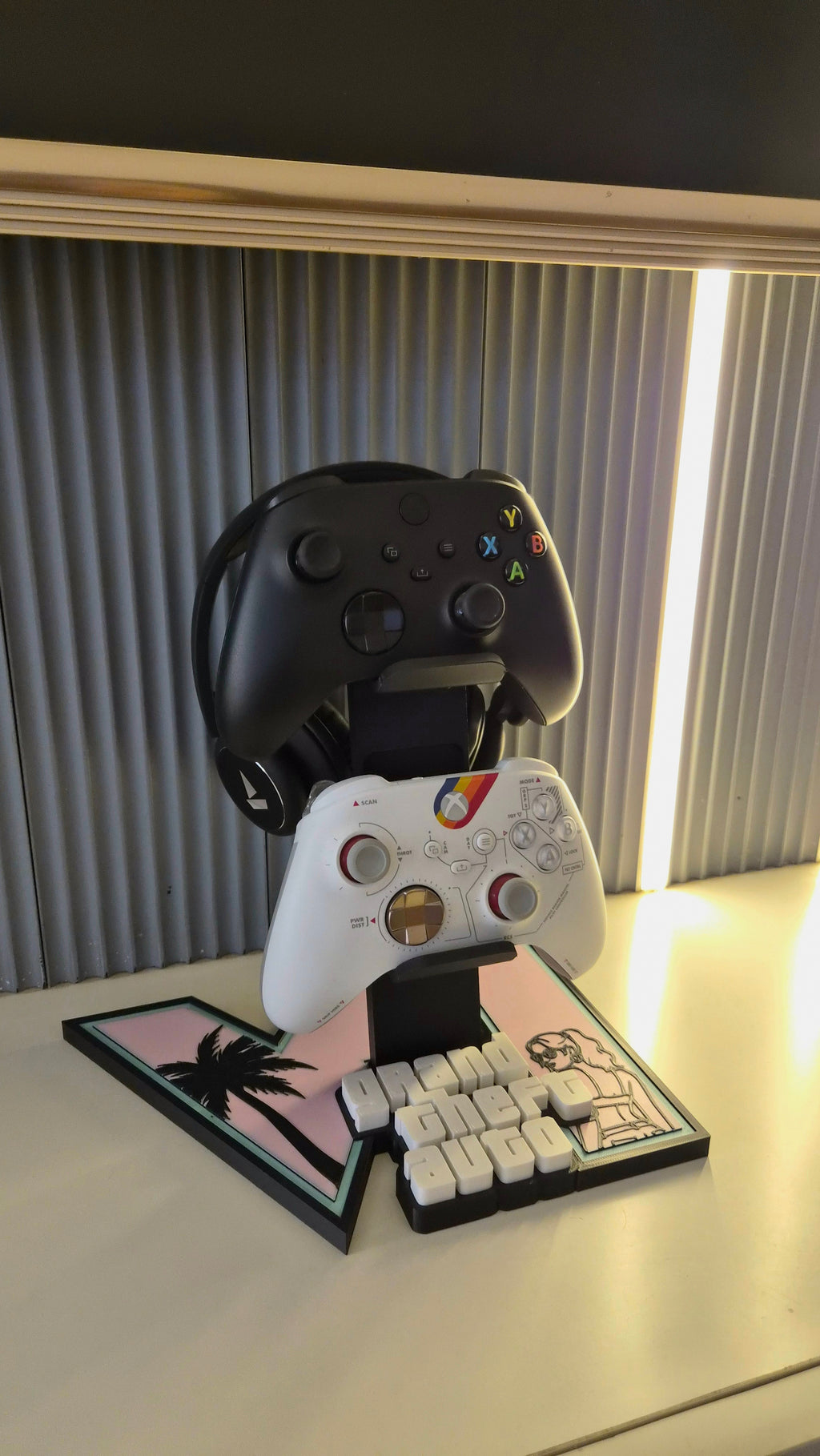 Angled view of the limited edition GTA 6 controller stand holding two controllers and a headset