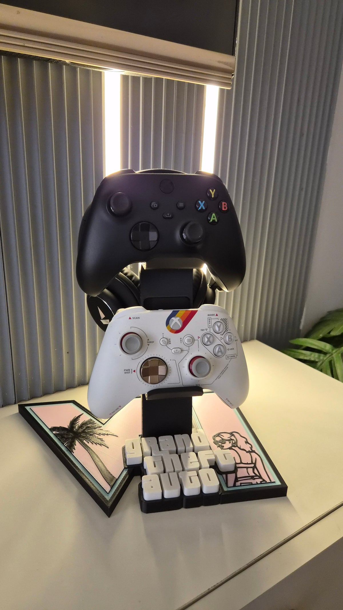 GTA 6 themed PLA Pro stand organizing two controllers and one headset on a gaming desk